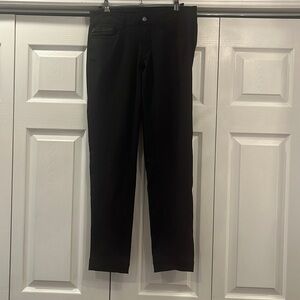 Lululemon black pants with zipper and button closure.